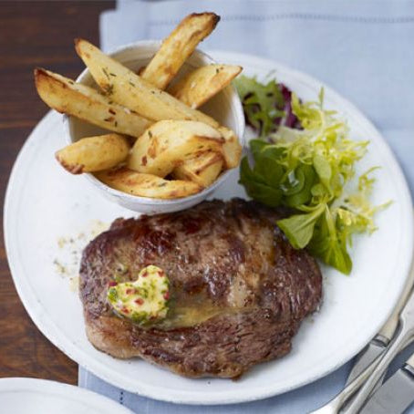 Halal Rib-eye steaks with chilli butter & homemade chips